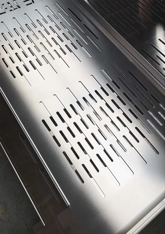 Finished perforated stainless steel sheet metal part after deburring