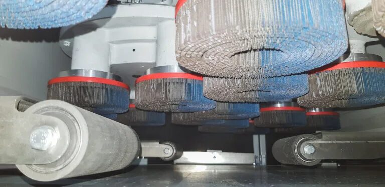 HERO deburring disc brushes mounted on Eberhardt's grinding line